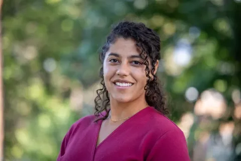 Hayley Blackburn smiles to camera in a headshot